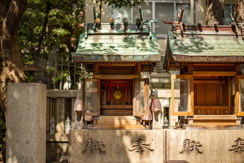 Small altars in the precinct of Namba Yasaka Jinja.