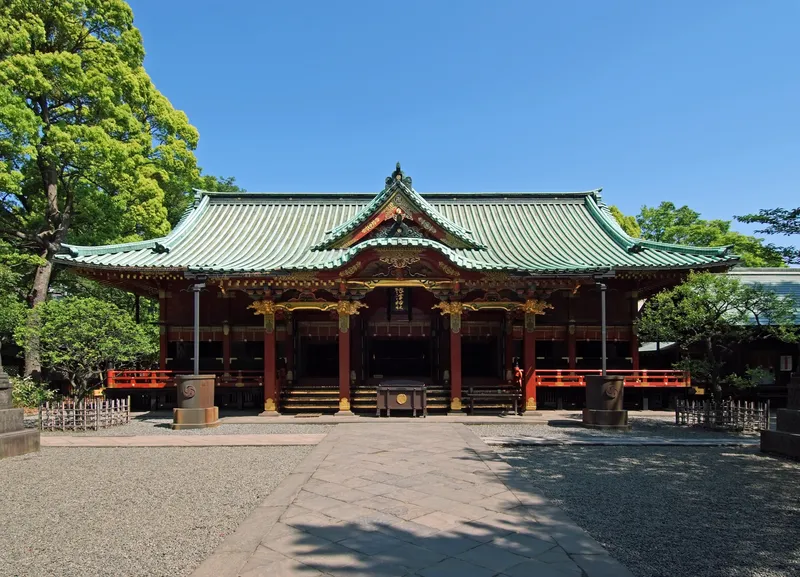 The 1706 worship hall of Nezu Shrine, lacquered red and black beneath a deep roof