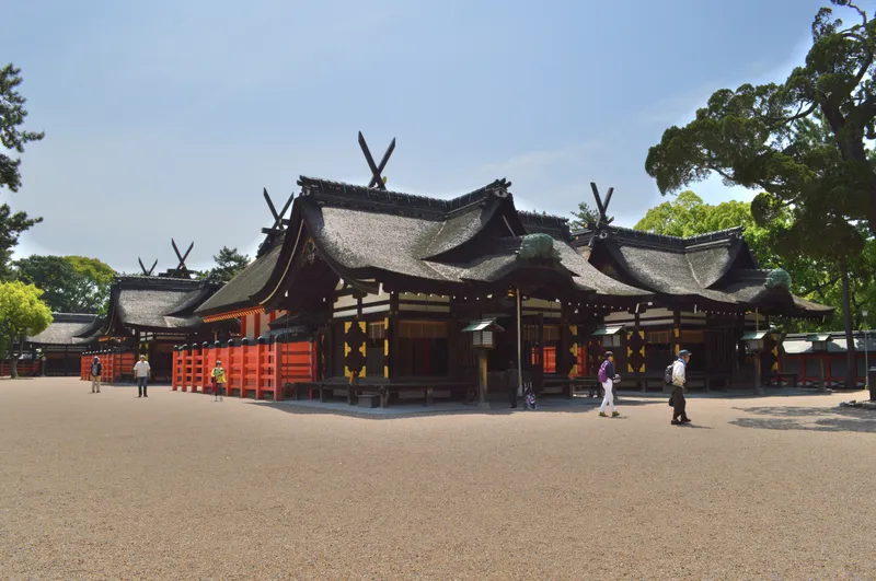 The grounds of Sumiyoshi Taisha, main sanctuaries in the sumiyoshi-zukuri style standing in file.